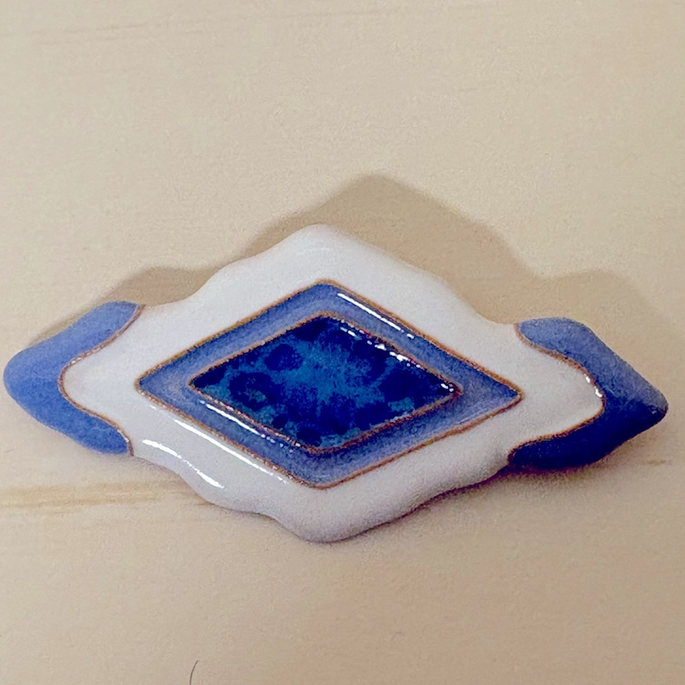 Very pretty blue and white pin.